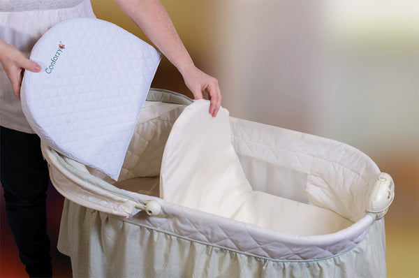 Baby wedge outlet for bassinet